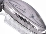 a close up of a watch on a white surface