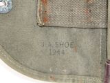 a close up of a bag with a button on it