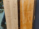 two wooden doors sitting next to each other on the floor