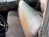 an old car with a steering wheel and a dashboard