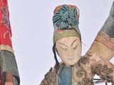two figurines that are standing next to each other