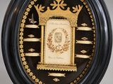 black and gold framed picture of a clock with a crown on it