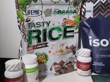 a bag of tasty rice next to some other foods