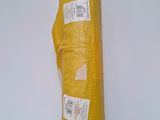 a yellow bag that is wrapped up on a white surface