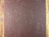 an old wooden frame with a chalk board attached to it