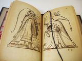 a book with drawings on it and a book with a picture of a man and a woman