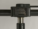 a close up of a metal pole with a sign on it