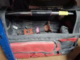 a bag with a baseball bat in it sitting on a table