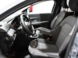 the interior of a car with a steering wheel and leather seats