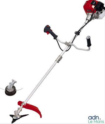 a close up of a red and white string trimmer on a white background