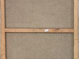 an old wooden frame with a piece of fabric hanging on it