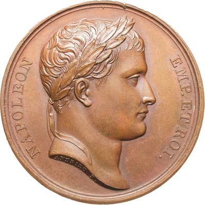 gros plan d'une pièce de monnaie sur laquelle figure une tête d'homme