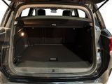 the back of a car with its trunk open and the back seats folded down