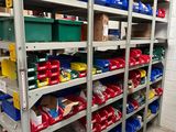 many bins and bins on the shelves in the room