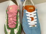 pair of children ' s caval shoes in front of a box of caval shoes