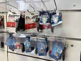 a display of batteries on the wall in a store