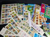 a lot of stamps and postcards on the table