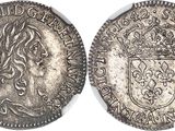 a silver coin with a crown on top of it