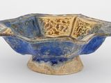 bol en céramique bleu et jaune orné d'un motif floral