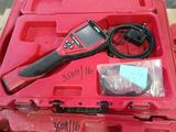 an image of a tool in a red case on a table