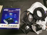 a box with a camera and a charger on the table