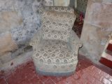 a chair that is sitting in the corner of a room