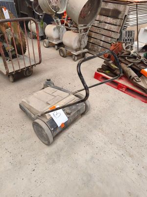 a lot of junk on the floor in a warehouse