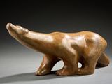 an image of a sculpture of a polar bear on a gray surface
