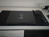 a laptop computer sitting on top of a desk with a mouse