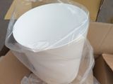 a large white bowl sitting in a box on the floor