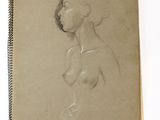 un vieux livre sur lequel figure le dessin d'une femme