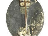 a picture of a dirty toilet seat with a rusted handle
