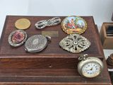 a wooden box with many different items on top of it