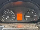 a close up of a car dashboard with a speedometer and other gauges