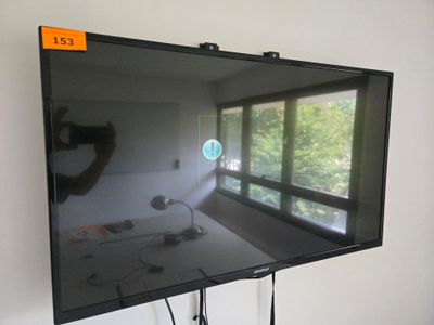 a flat screen tv on a stand in a room