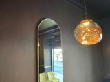 a mirror hanging on the wall in a restaurant