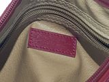 the inside of a red purse with a zipper on it