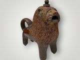 a statue of a lion that is on the wall