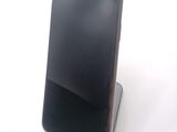 a cell phone that is sitting on top of a stand