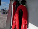 two life jackets hanging on the side of a boat