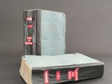 two books sitting on top of each other on a table