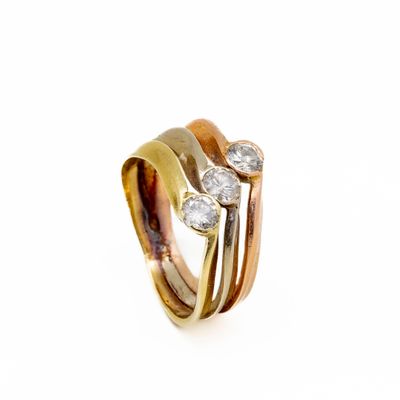 an image of a gold and diamond ring on a white background