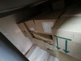 boxes are stacked on top of each other in a room