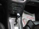 a picture of a car dashboard with a remote control in it