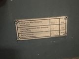 an old machine with a label on the side of it