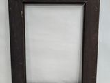 a close up of a picture frame on a white surface