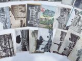 a lot of old black and white photos on a table