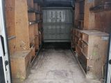 a white van that has a lot of boxes in the back