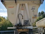 a dump truck that is parked on the side of the road