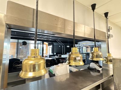 many lights hanging from the ceiling in the kitchen